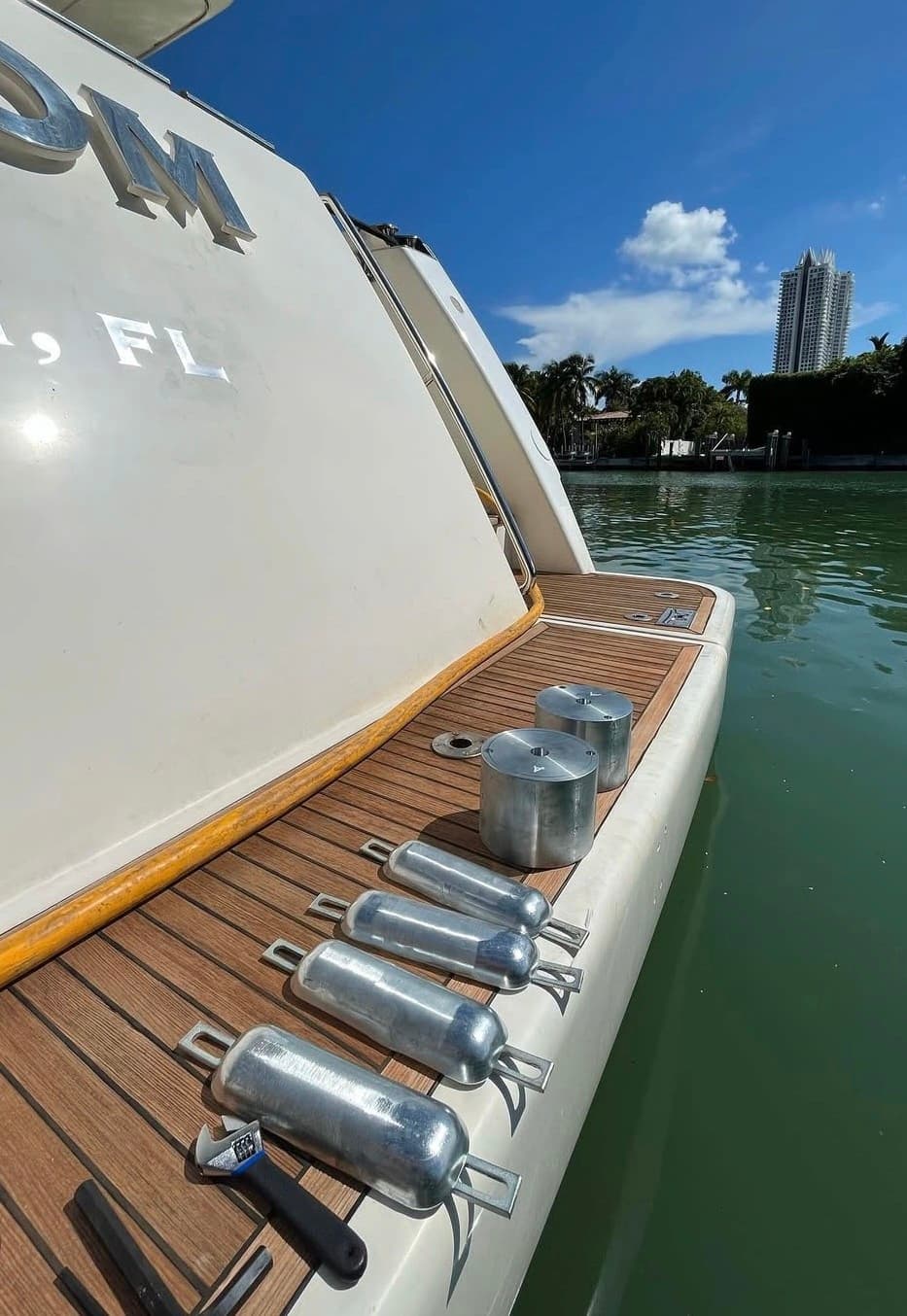 New zinc anodes lined up on a yacht's teak deck